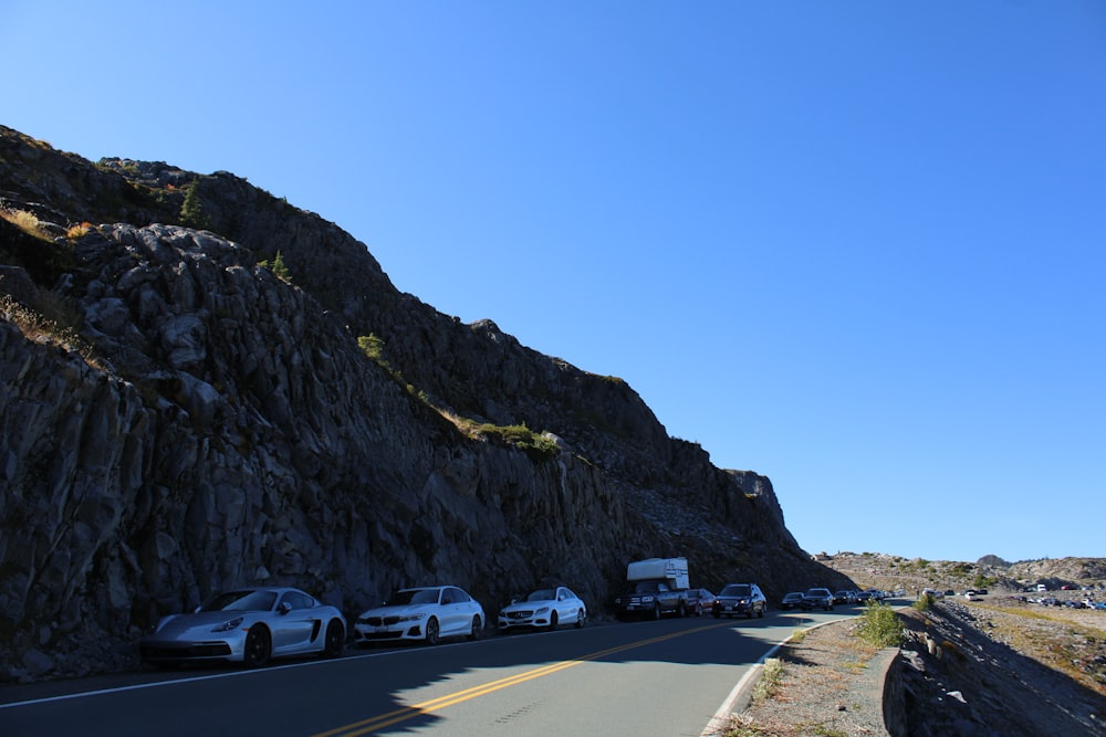 a group of cars parked on the side of a road