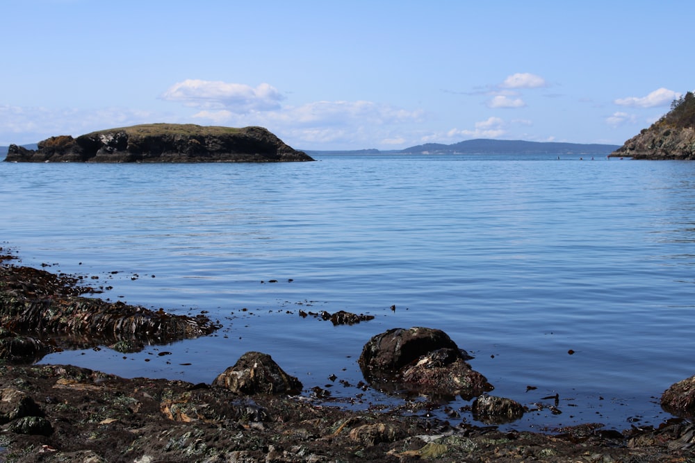 a large body of water surrounded by rocks