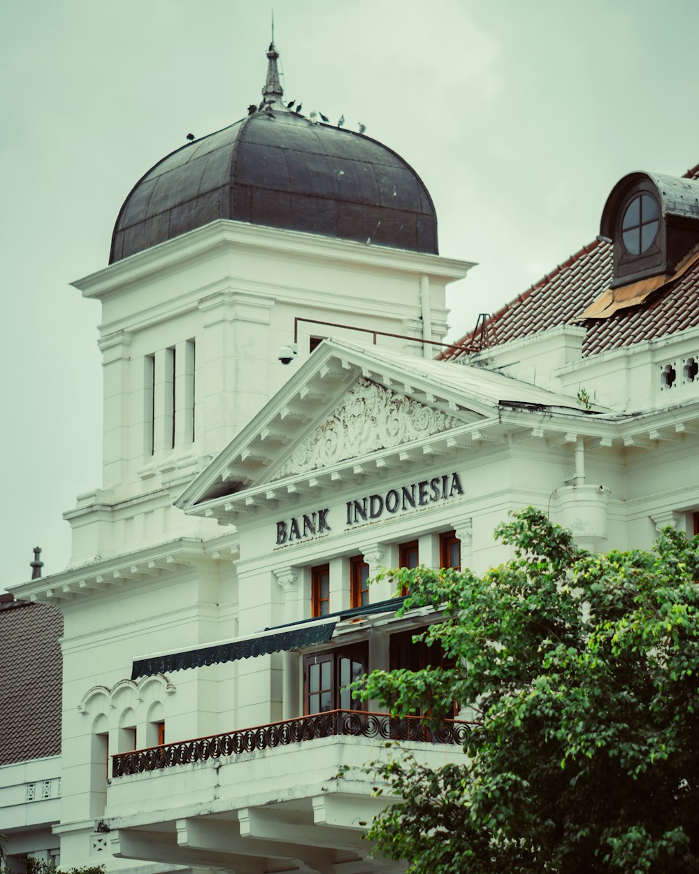 a large white building with a dome on top