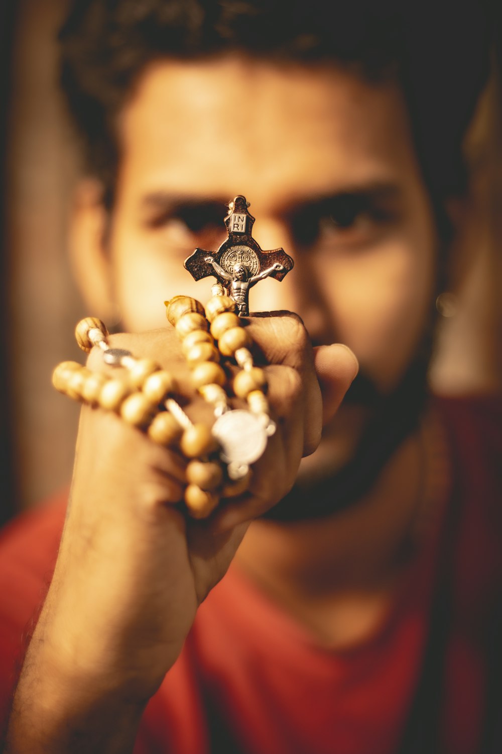 a man holding a rosary in his hands