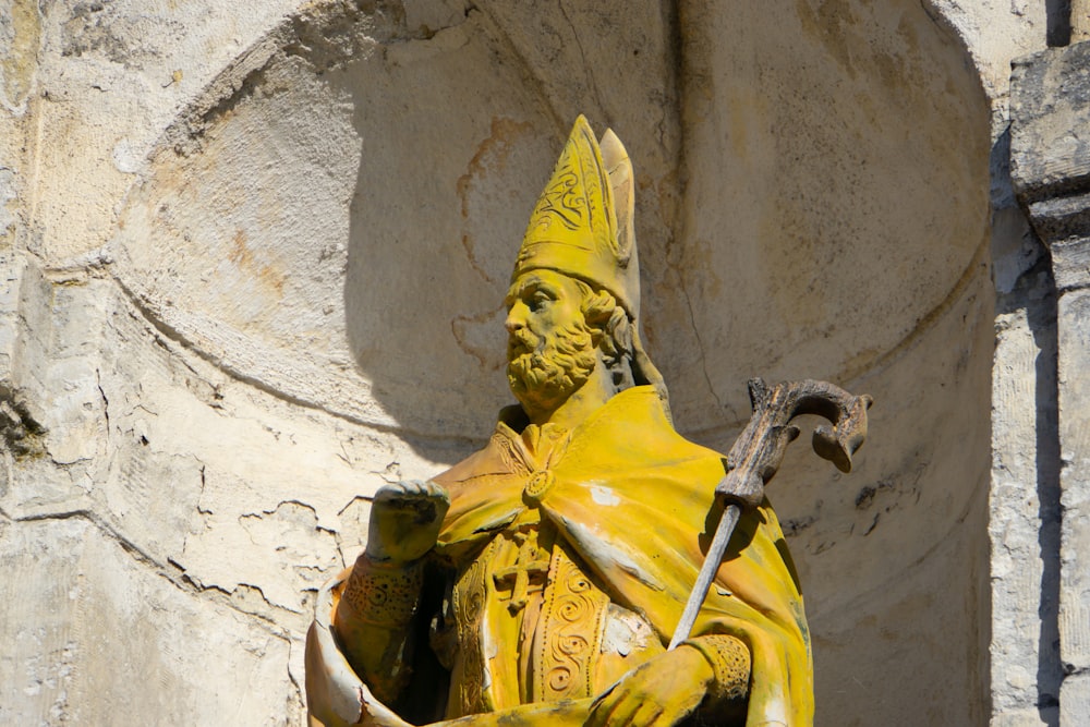 a statue of a man holding a sword