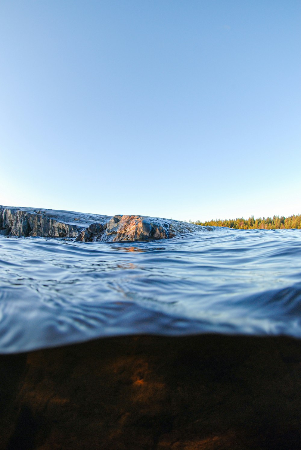 a body of water that has some rocks in it