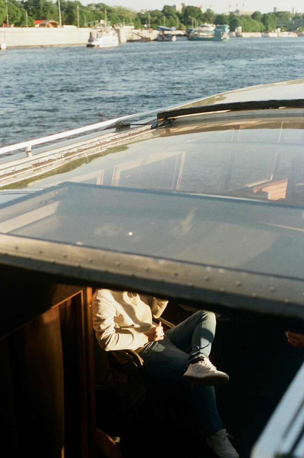 a person sitting on a boat in the water