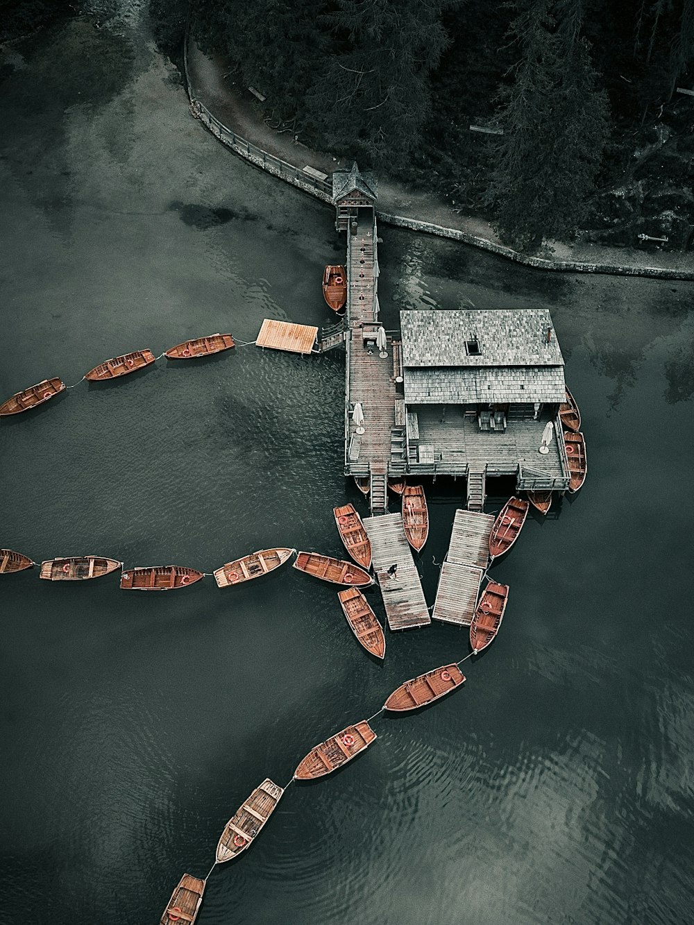 a boat dock with several boats in the water