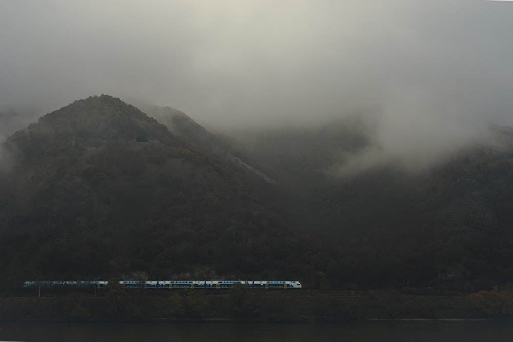 a train on a train track near a body of water