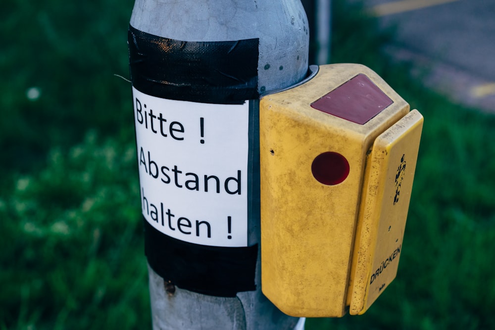 a close up of a street sign on a pole