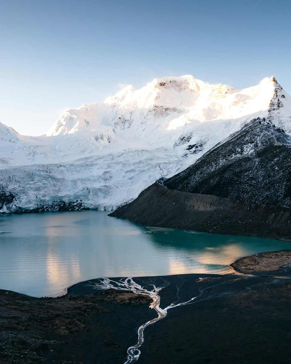 a mountain with a lake in front of it