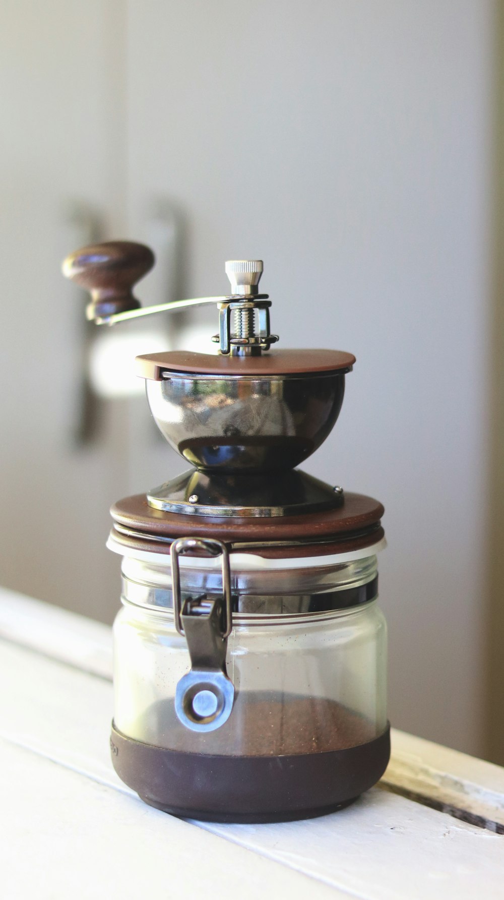 three jars with lids stacked on top of each other