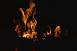 a close up of a fire in the dark