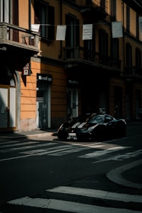 a couple of cars parked on the side of a road