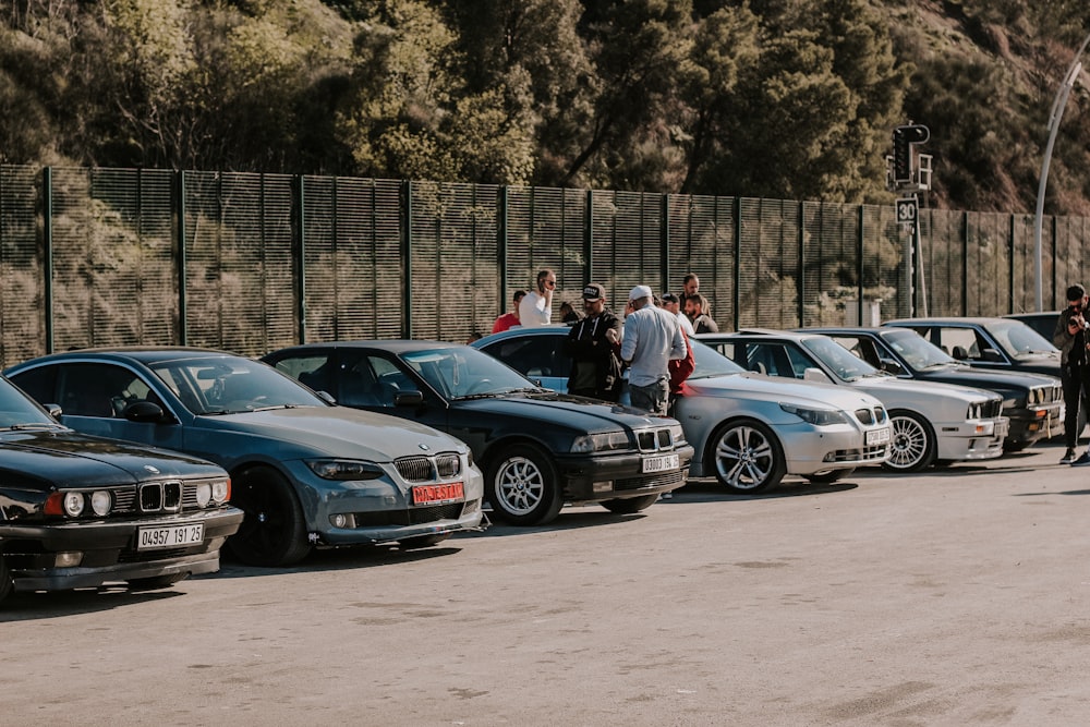 a group of cars parked next to each other in a parking lot