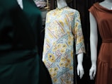three mannequins dressed in different styles of clothing