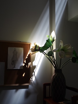 Display of floral-themed pins on a corkboard with soft natural light.