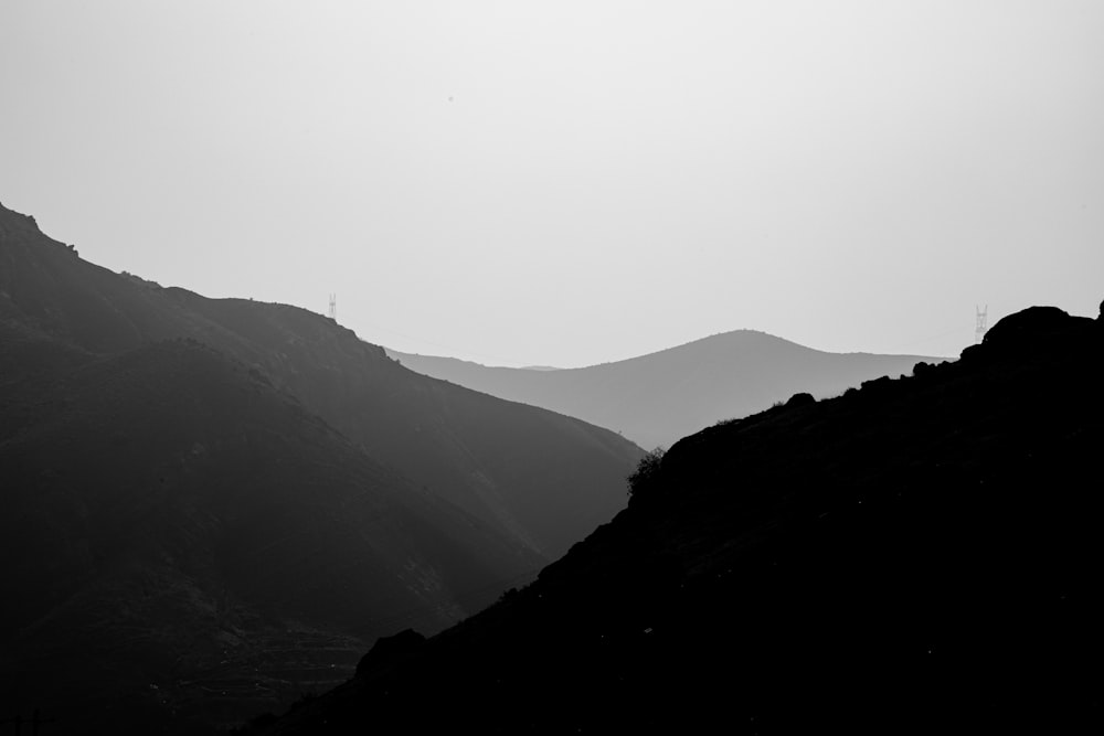 a black and white photo of a mountain range