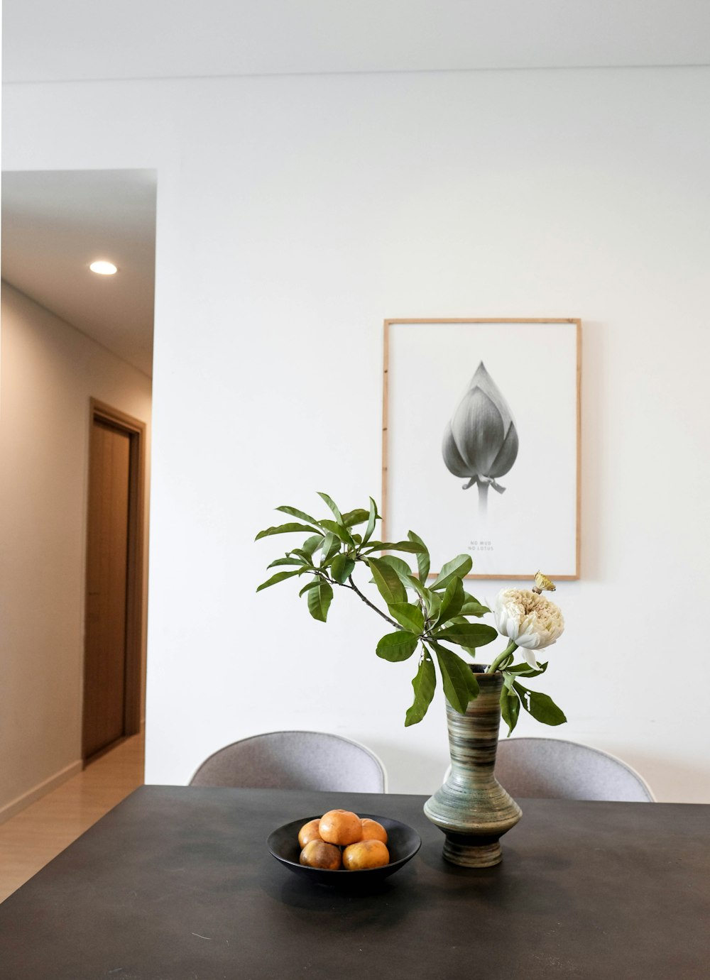 a black table topped with a bowl of fruit