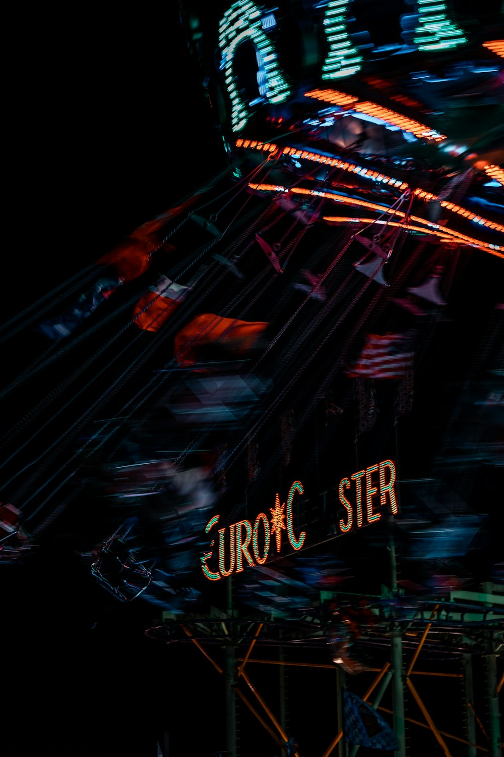 a merry go round at night with lights on