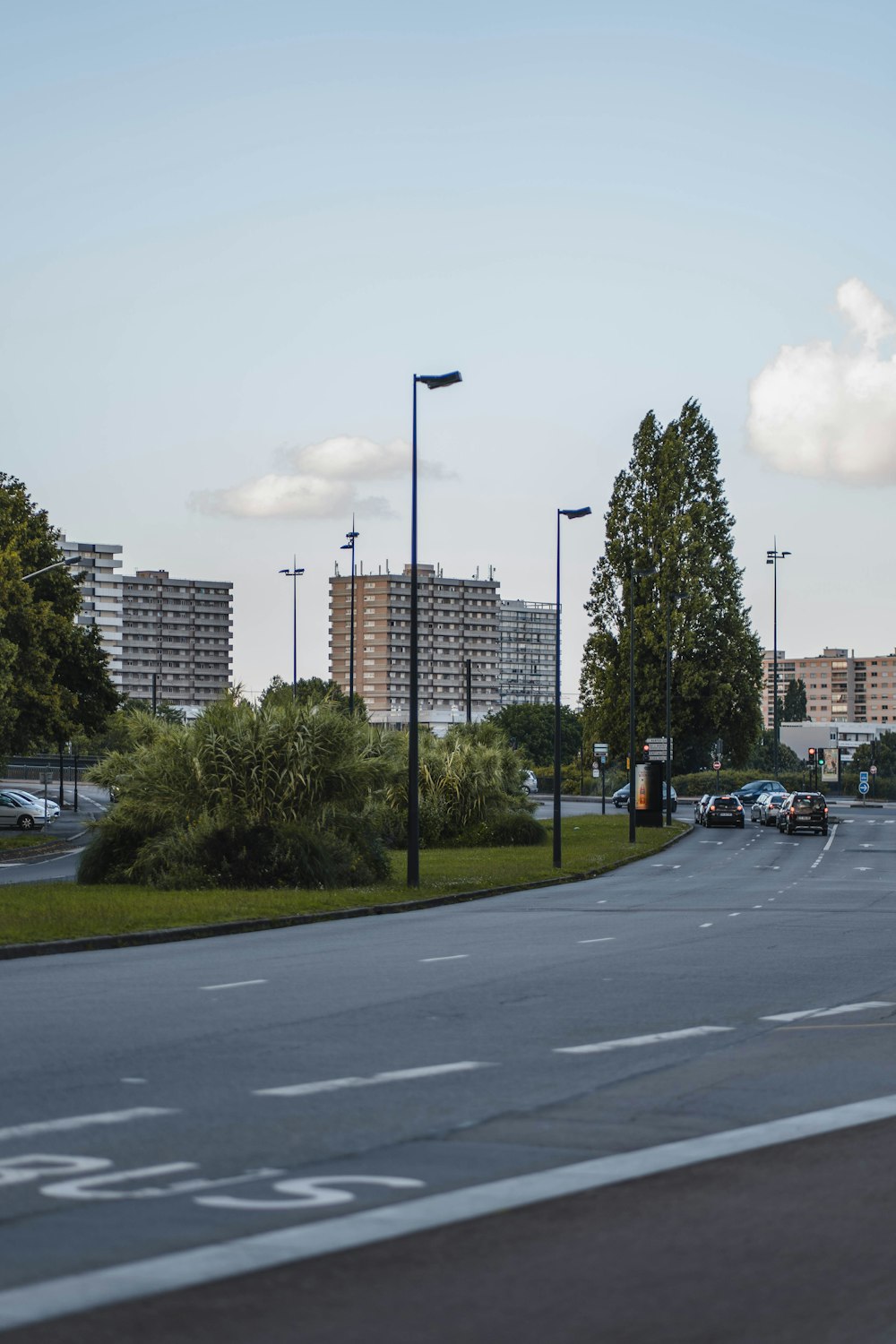 a city street with a few cars parked on the side of the road