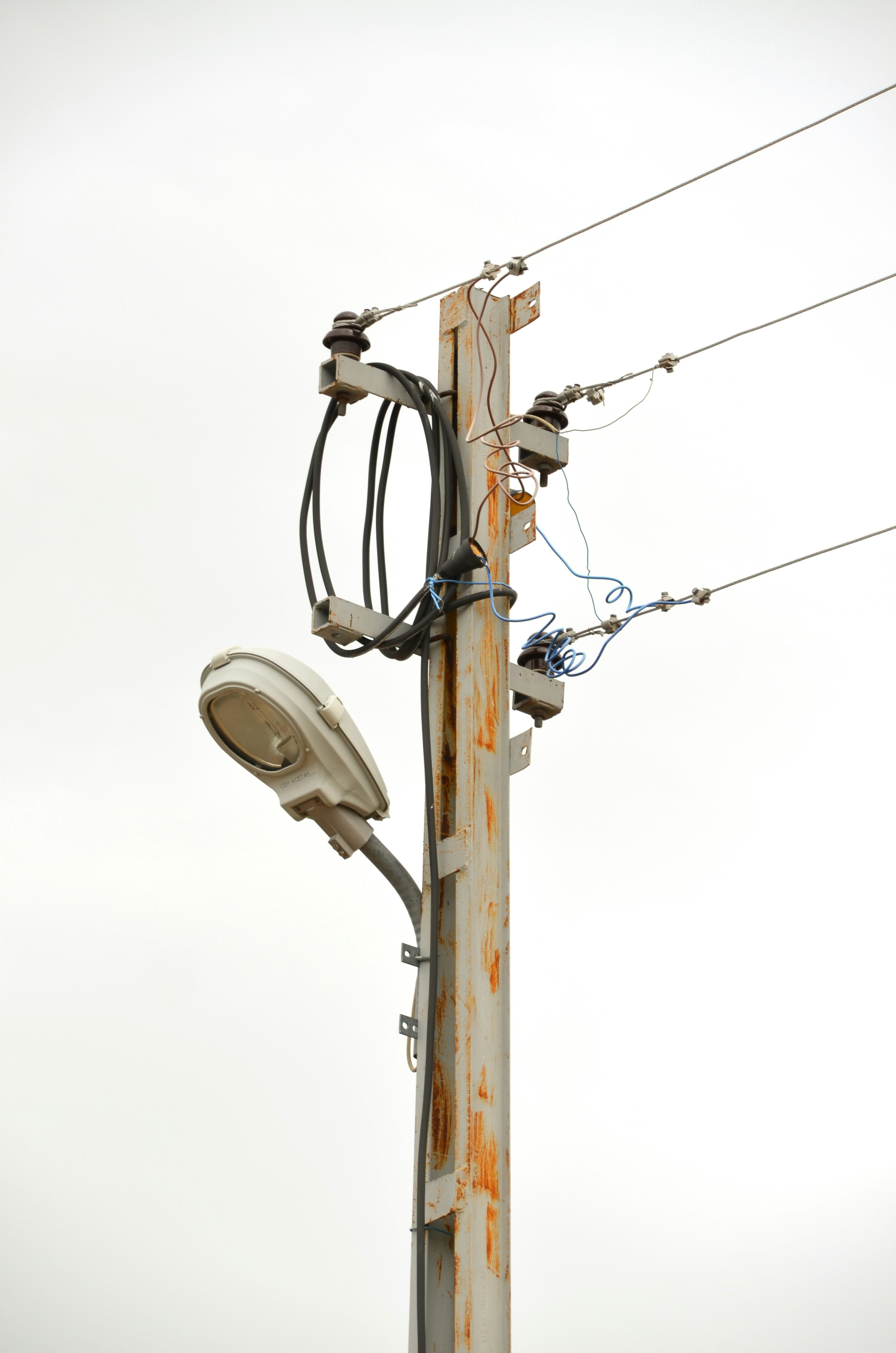 a telephone pole with a bunch of wires attached to it