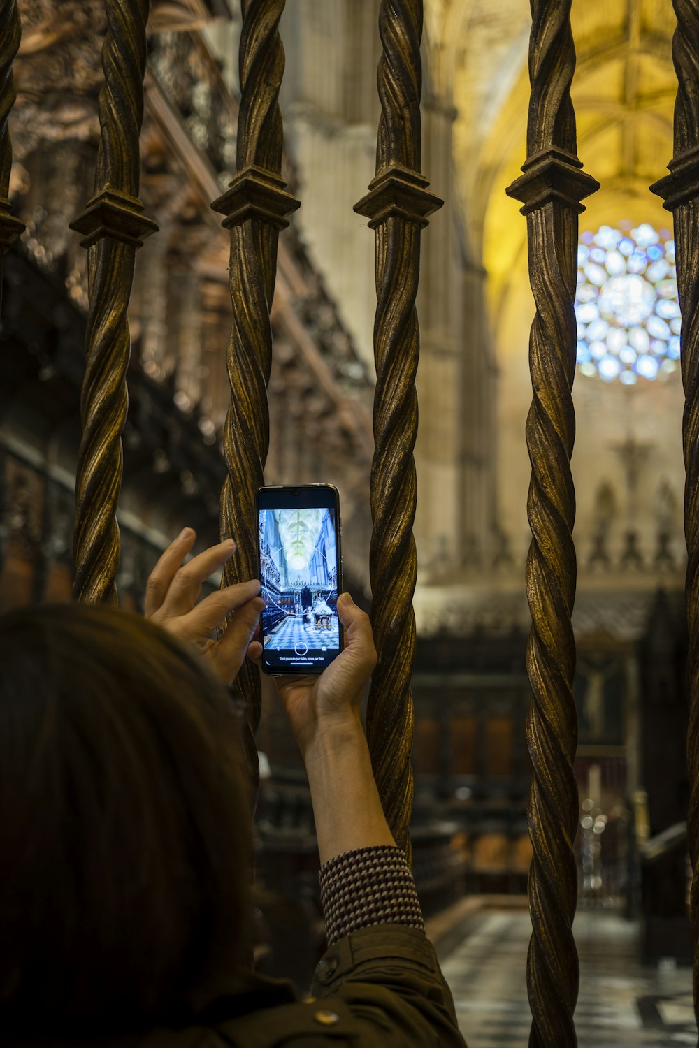 a person taking a picture of a building with a cell phone