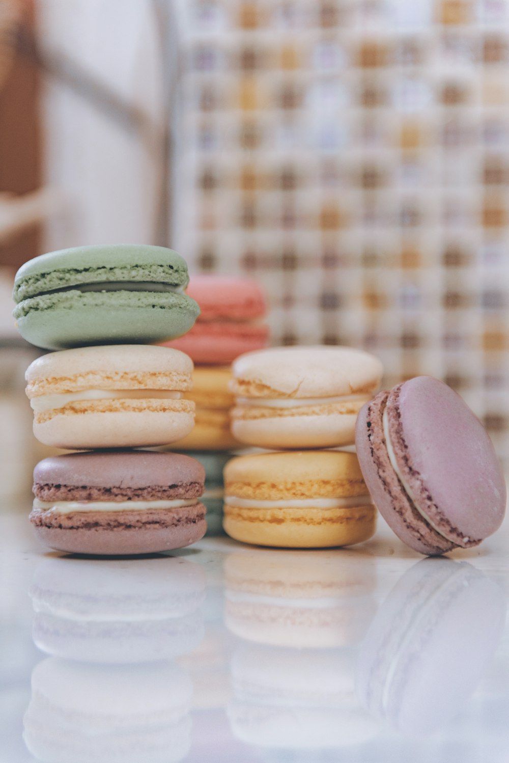 a stack of macaroons sitting on top of a counter