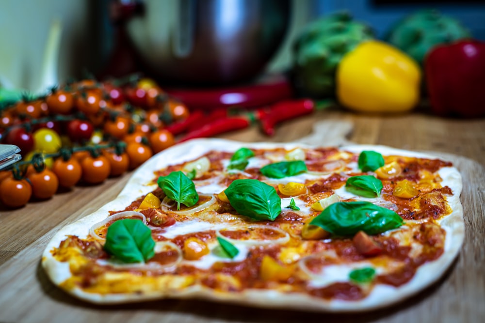 a pizza sitting on top of a wooden cutting board