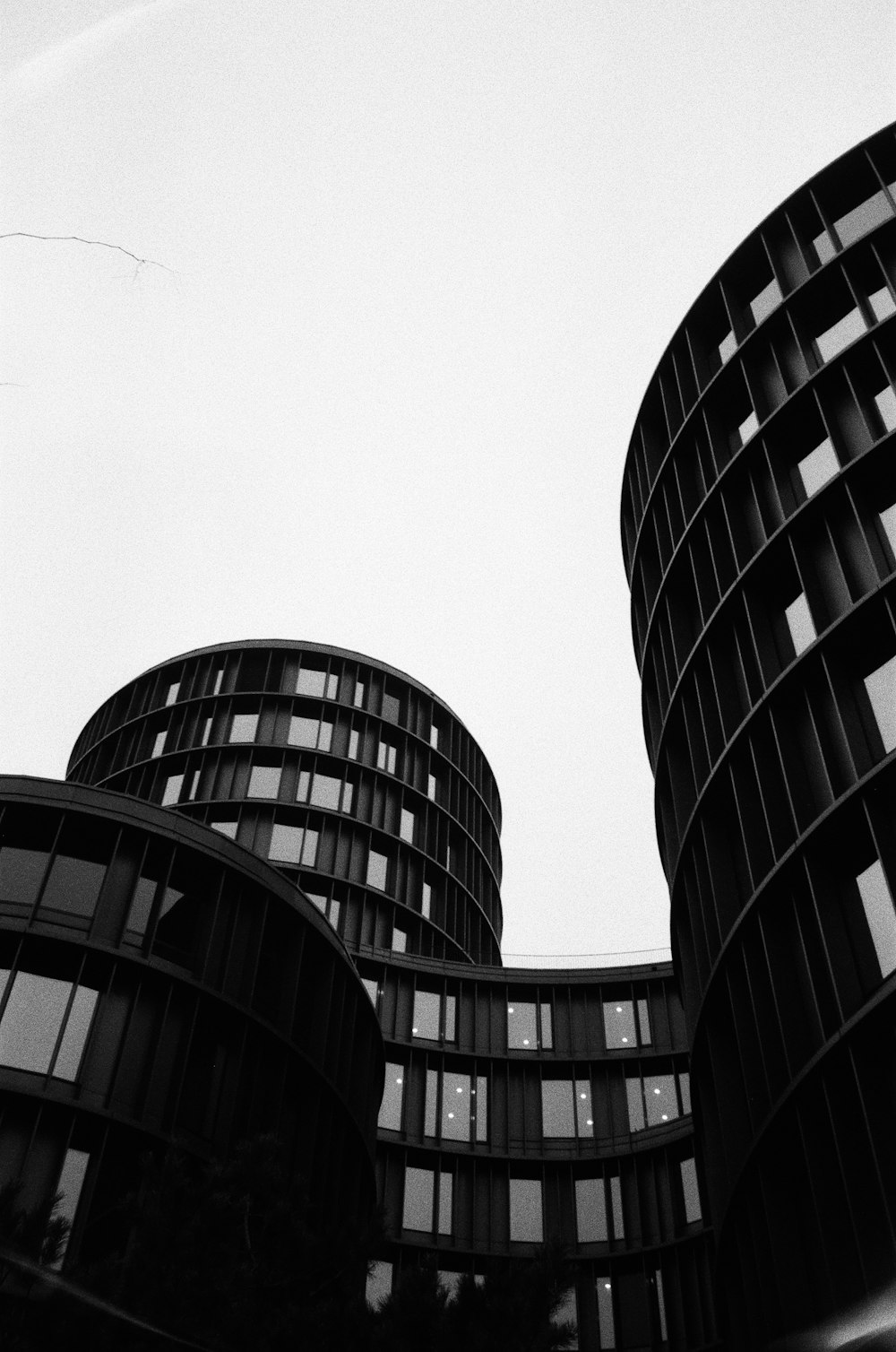 a black and white photo of two buildings