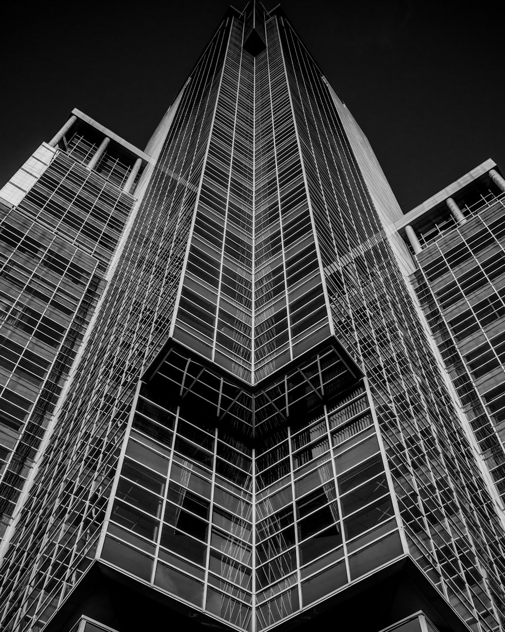 a black and white photo of a tall building