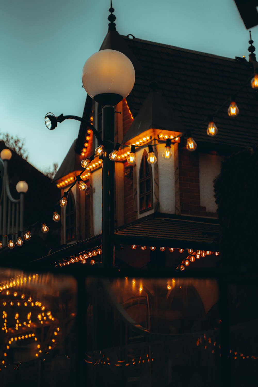 a street light with a building in the background