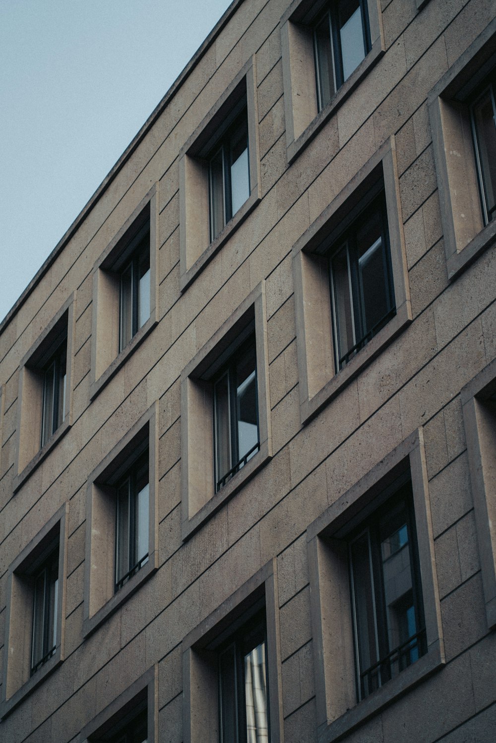 a tall building with lots of windows and a clock