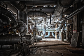 a large industrial building with pipes and piping