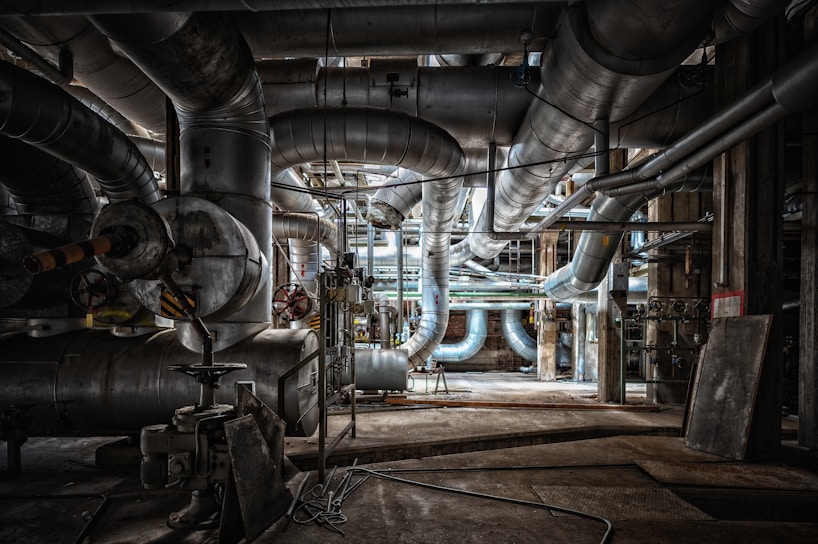 a large industrial building with pipes and piping