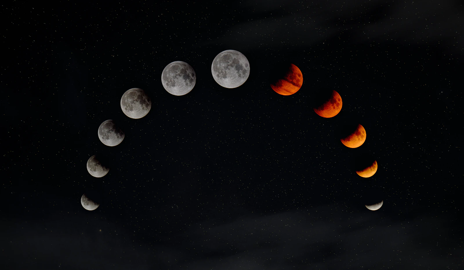 phases of the moon across a night sky