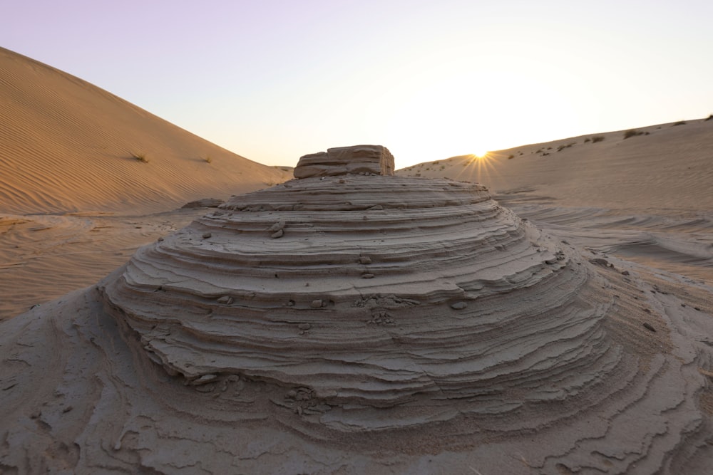 a sand dune in the middle of a desert