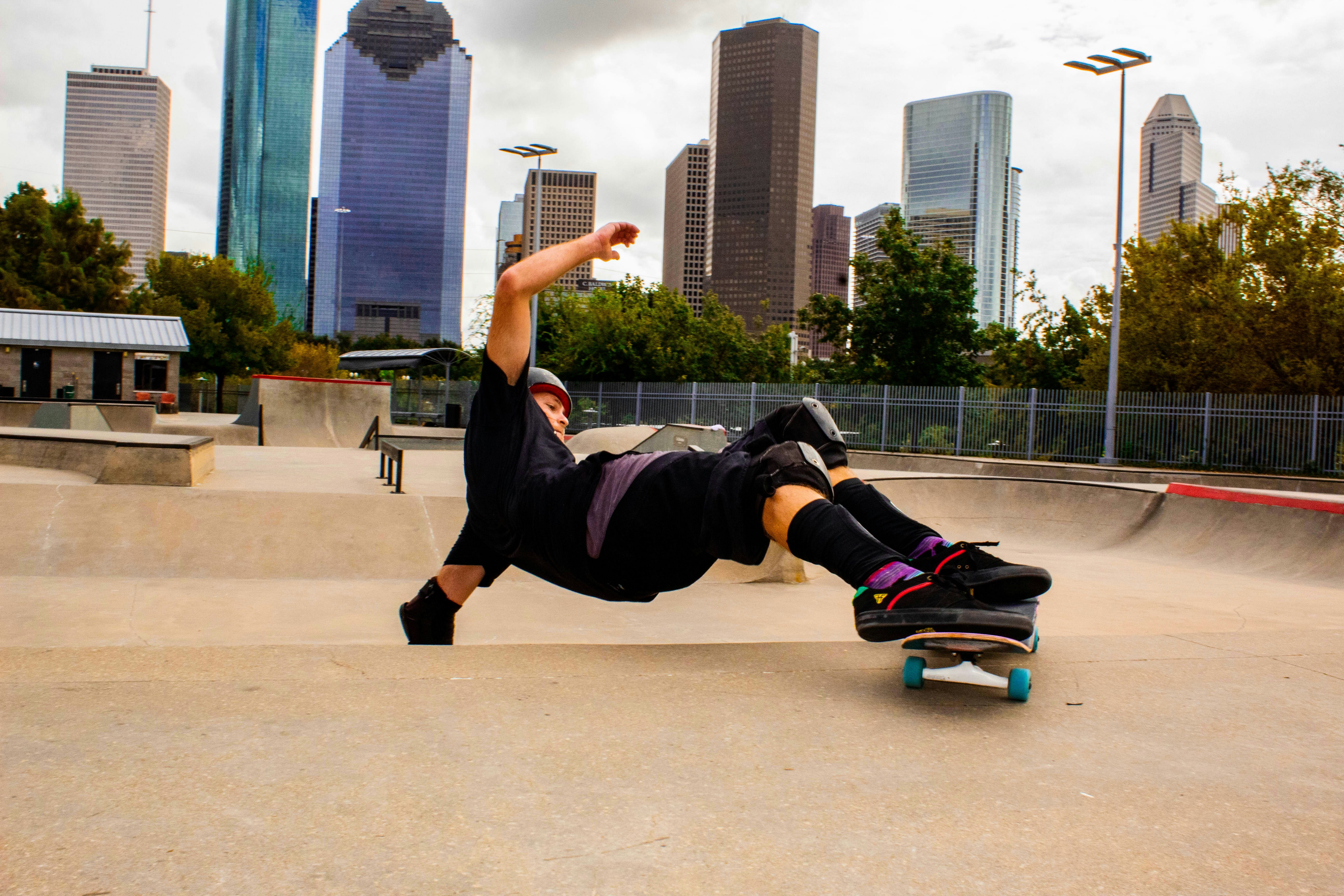 a man riding a skateboard on top of a ramp, 