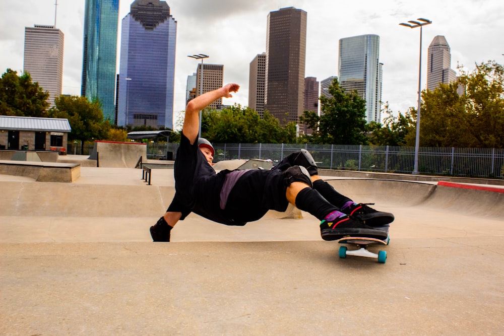 a man riding a skateboard on top of a ramp