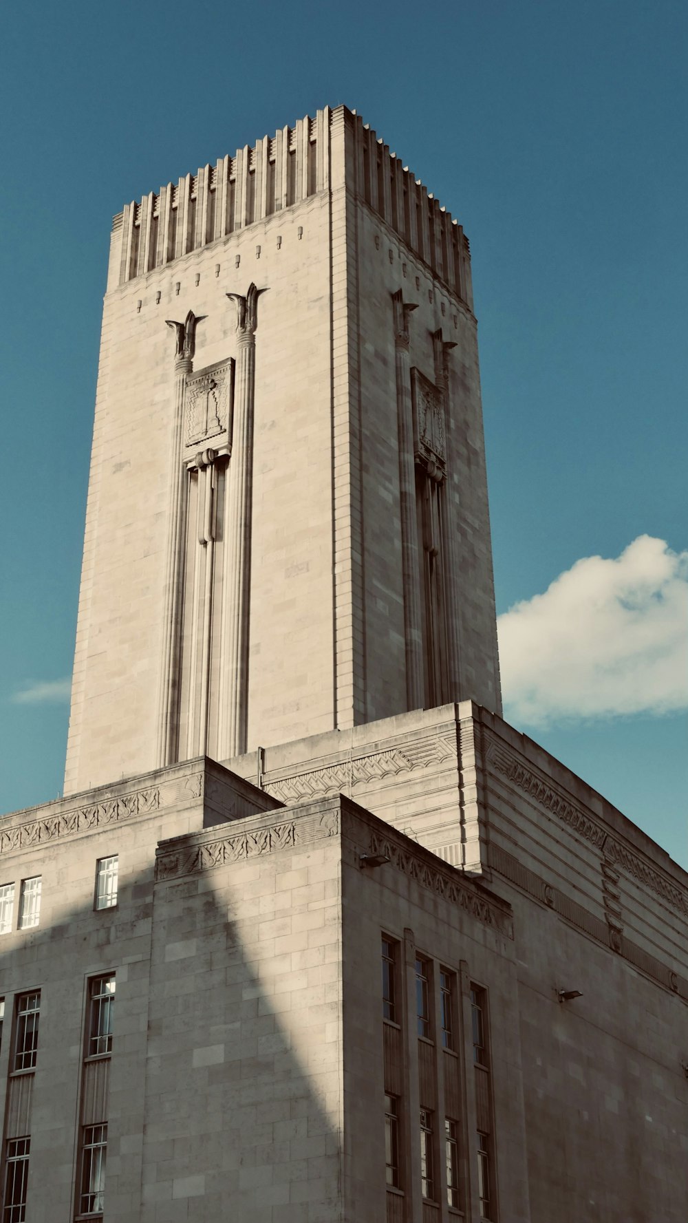 a very tall building with a clock on it's side