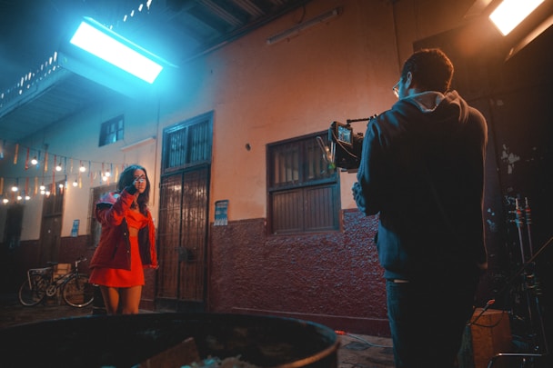 a man and a woman standing in front of a building