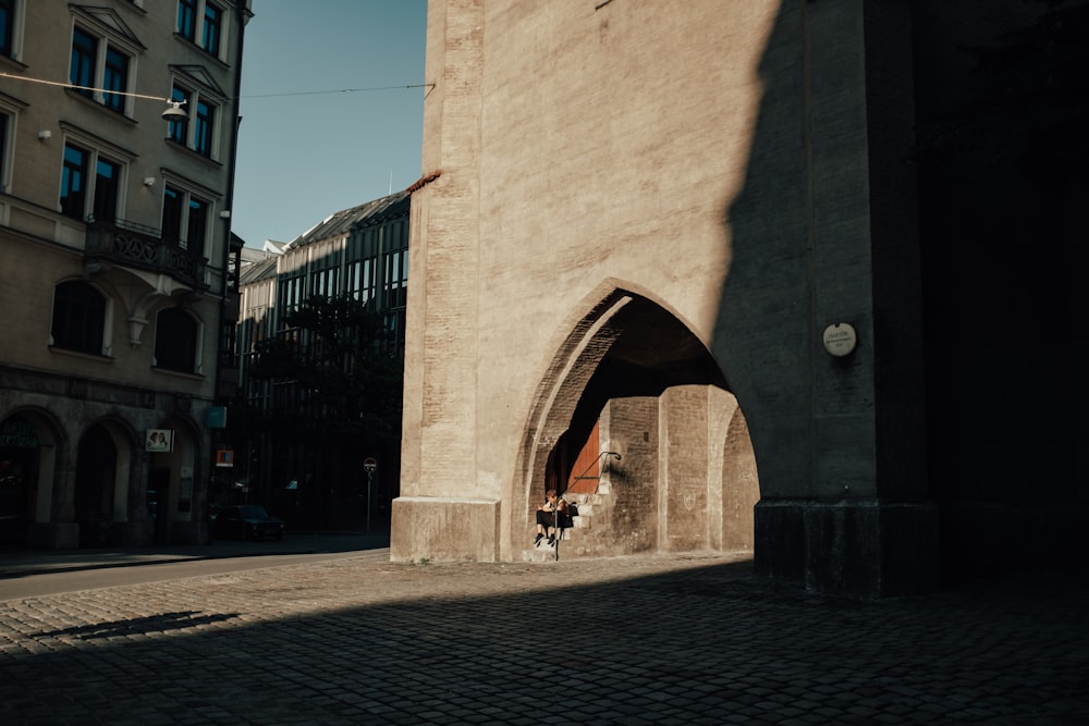 a person standing in a doorway of a building