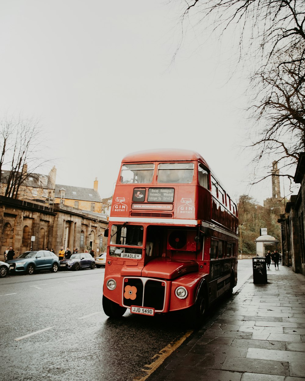 a double decker bus driving down a street