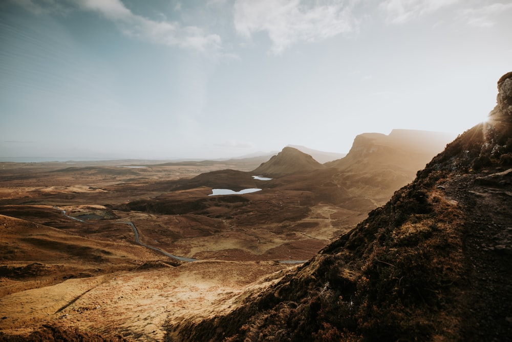 a view of a mountain with a river running through it