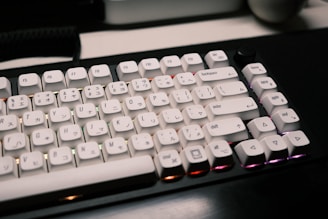 A sleek mechanical keyboard adorned with colorful otaku-style resin keycaps under soft lighting.