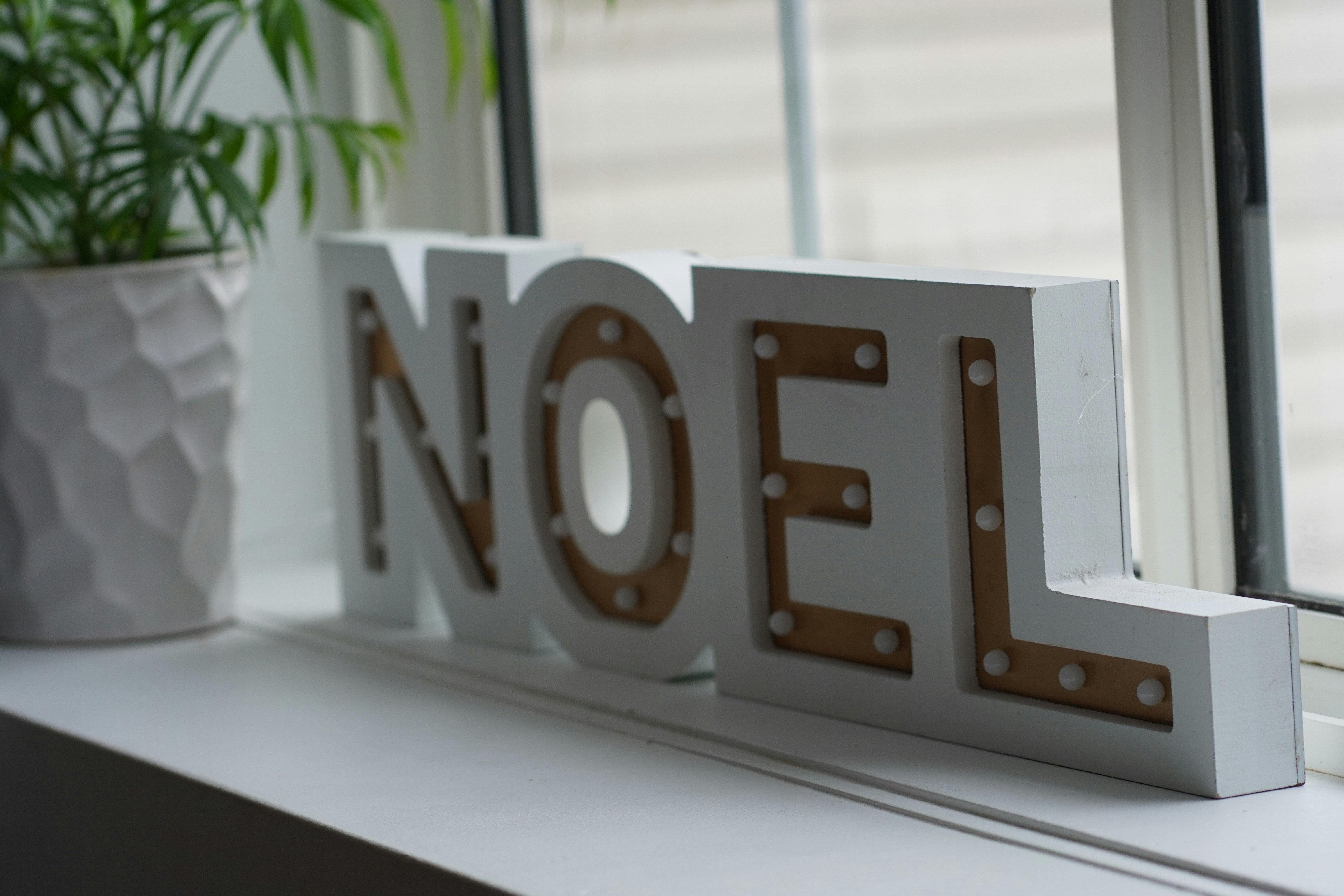 A close up of a sign on a window sill photo – Free Grey Image on Unsplash