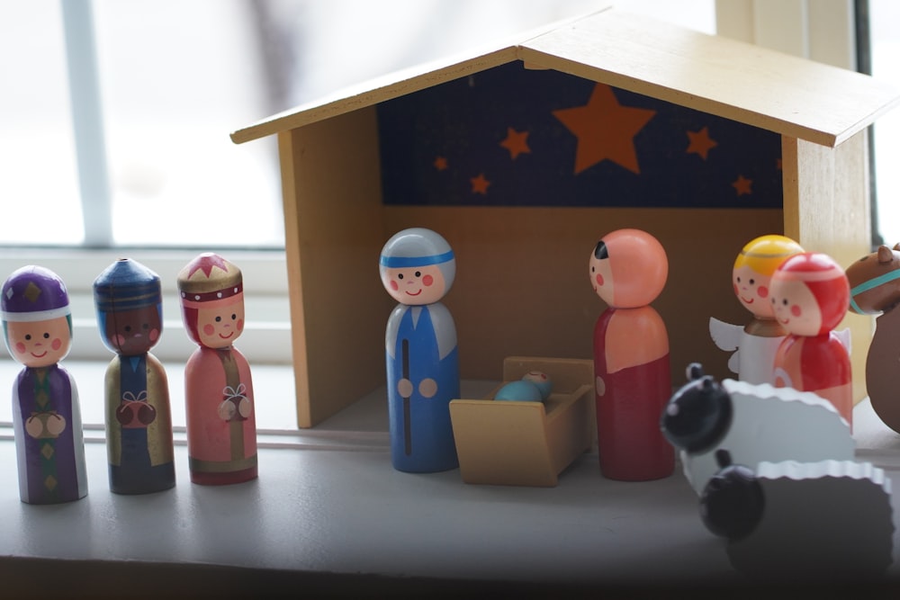 a nativity scene with figurines of people in a stable