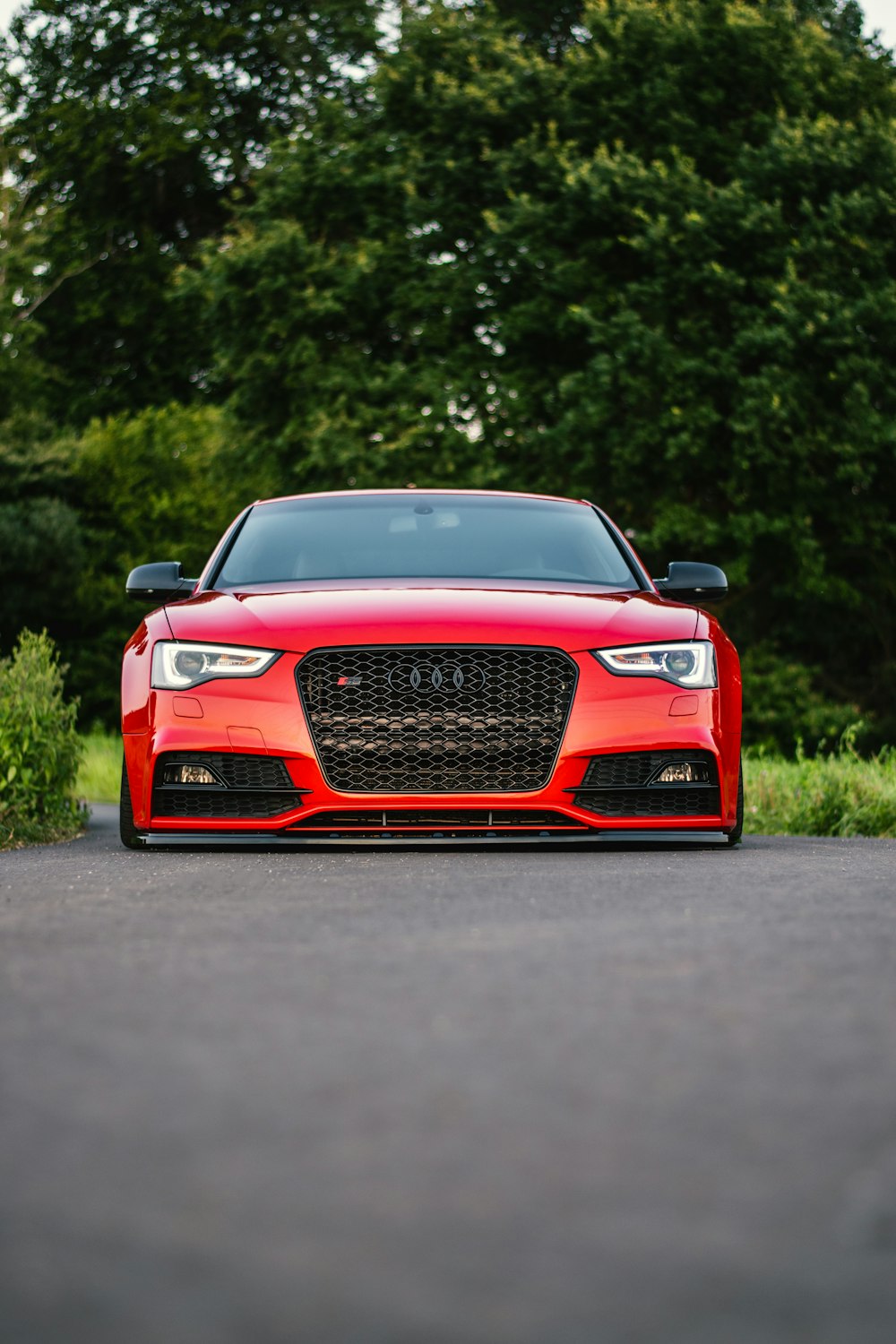 a red car parked on the side of the road