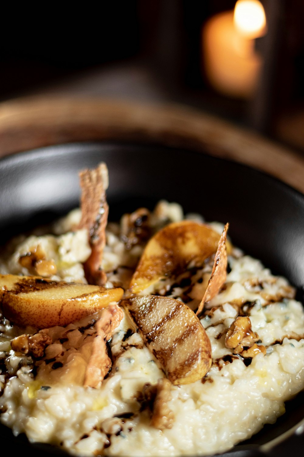 a black bowl filled with food on top of a table