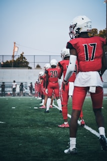Students lined up for a shooting drill under the watchful eye of their football coach.