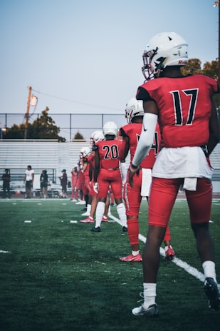 Students lined up for a shooting drill under the watchful eye of their football coach.