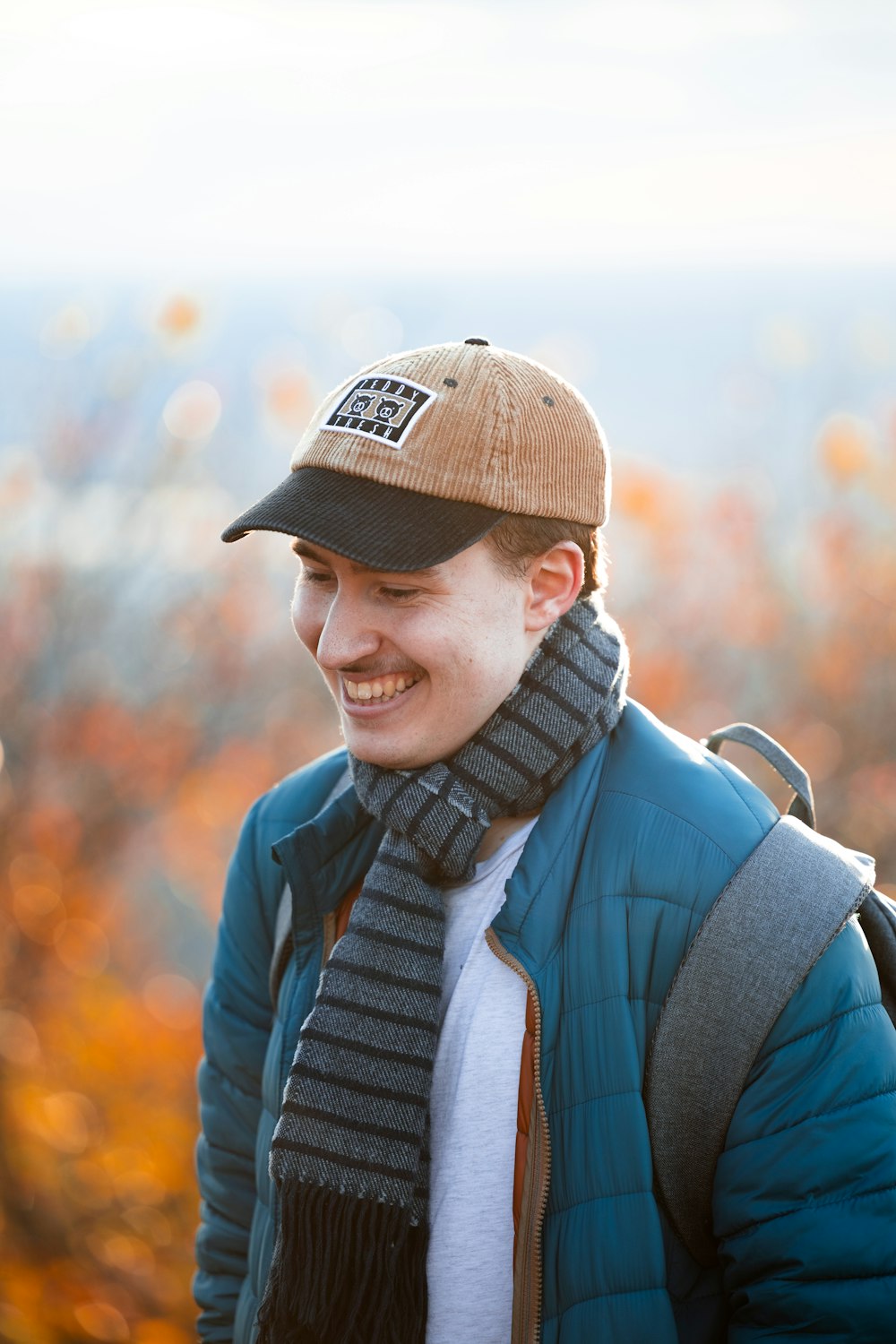 a man wearing a hat and a scarf