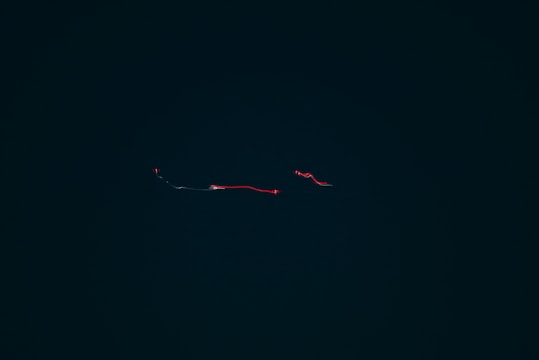 Minimalistic white background showing a clean data pipeline with smooth motion lines connecting nodes.