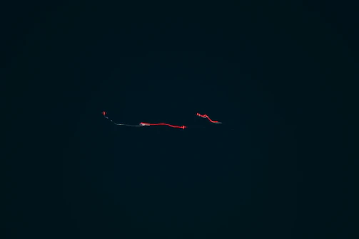 Close-up of minimalist website animations with smooth parallax effects on a dark background.